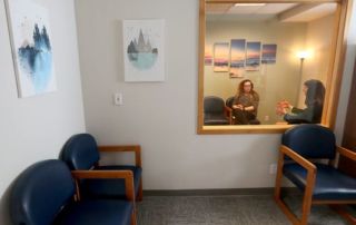 KMHS staff talk in observation room at new WISe Team offices in Bremerton