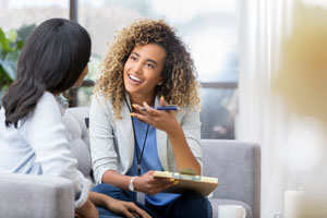 Mental health professional works with client