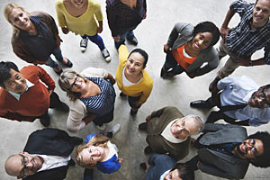 Several people looking upwards and smiling